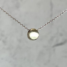 Load image into Gallery viewer, 14k Gold Tiny Circle Necklace by Philippa Roberts on a silver chain
