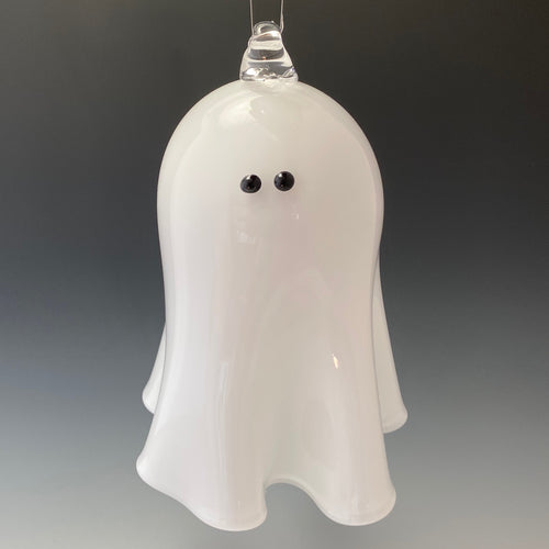 Hanging ghost is white fluted glass with black eyes and a loop for hanging
